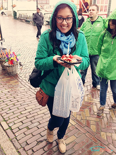 Jessica eating a strawberry and nutella waffle in the Netherlands
