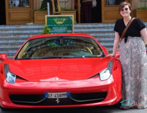 Emily in Monte Carlo, Monaco with a bright red Ferrari