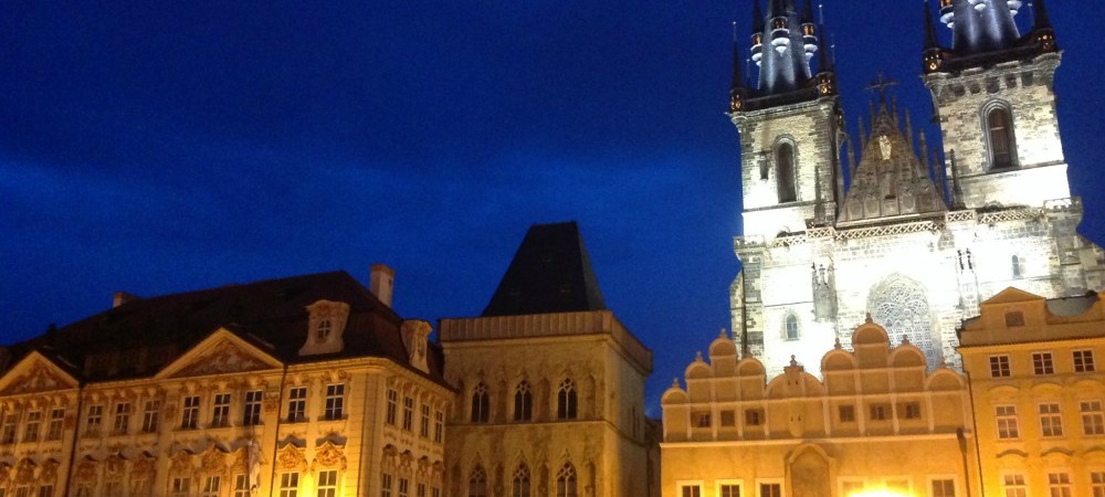 Old Town Square lit up at night in Prague